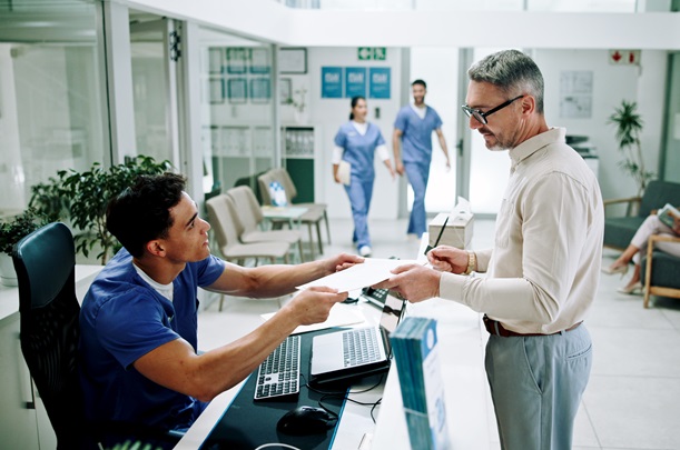 Hospital, nurse and man at front desk