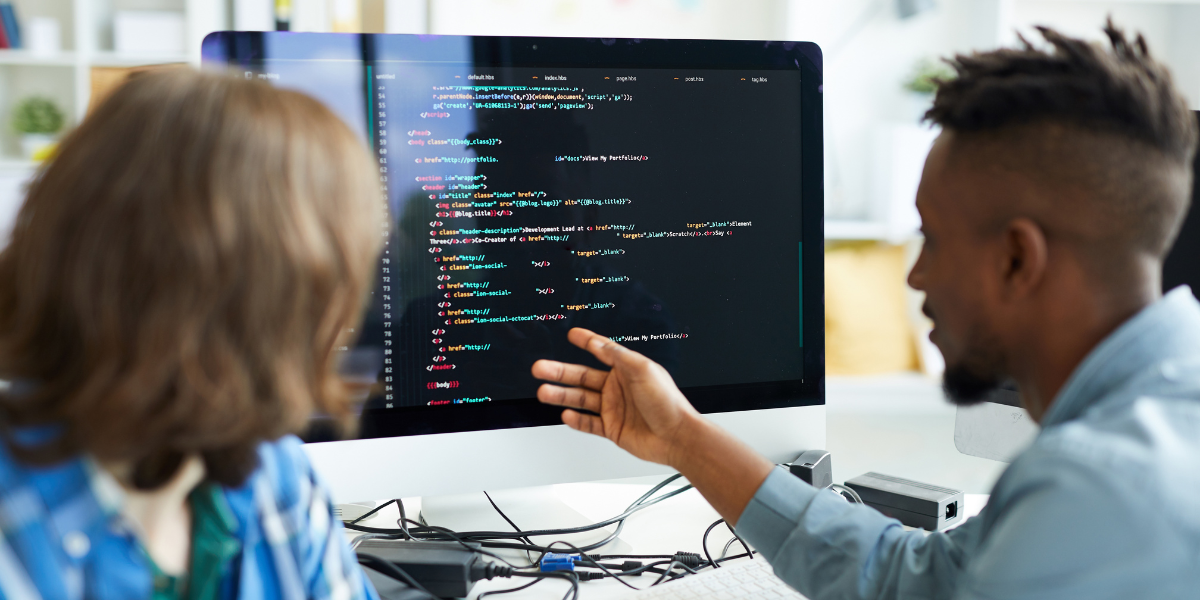 A close-up of two IT professionals coding. Build your IT career in Kerry with programming and development expertise.
