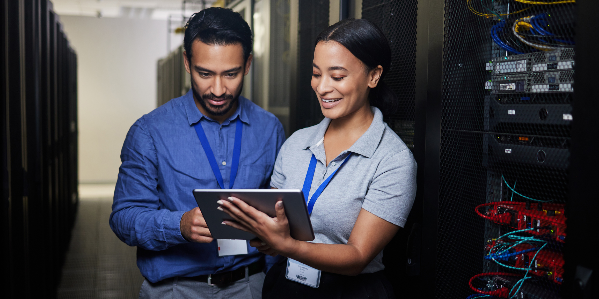 Two IT employees monitoring server performance. Kickstart your IT career in Kerry with top training in networking and system management.