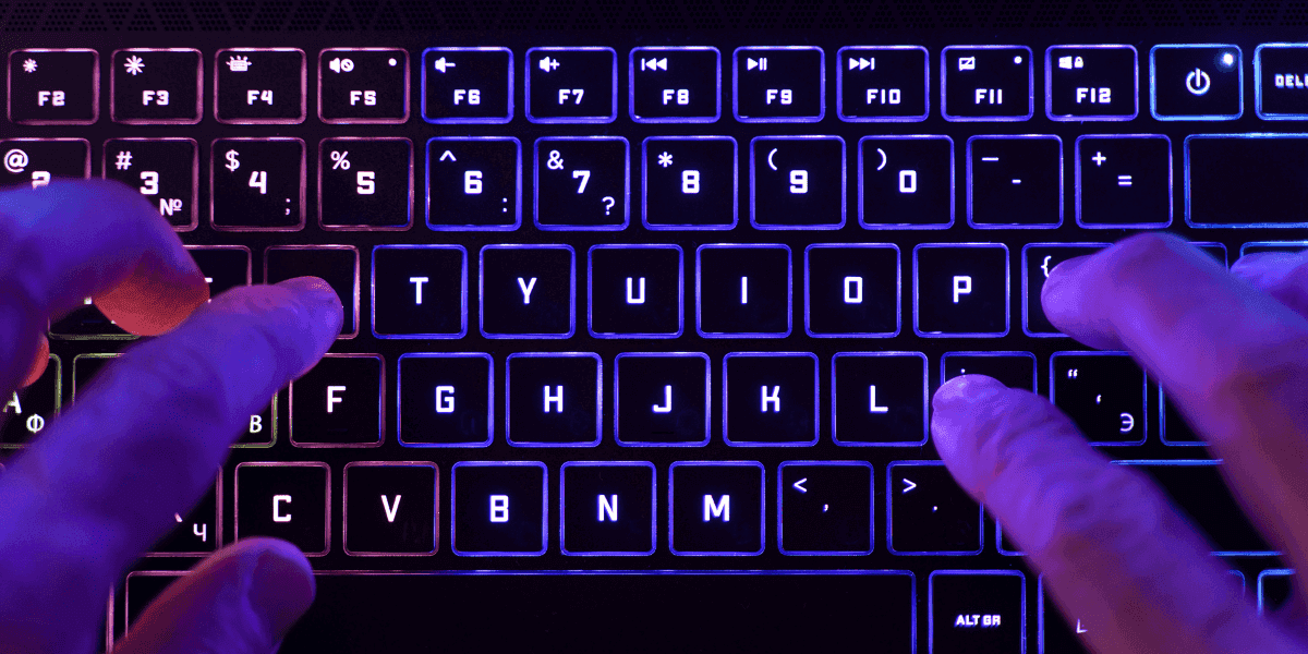 A detailed close-up of a mechanical keyboard featuring eye-catching RGB lighting, offering both aesthetics and performance to improve your workspace setup.