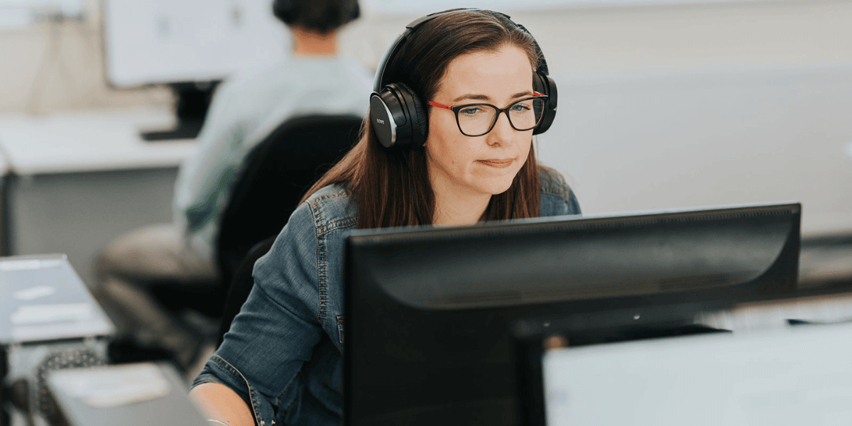 A student building her skills in an IT course, representing the accessible entry routes and growth potential of technology as a career path.
