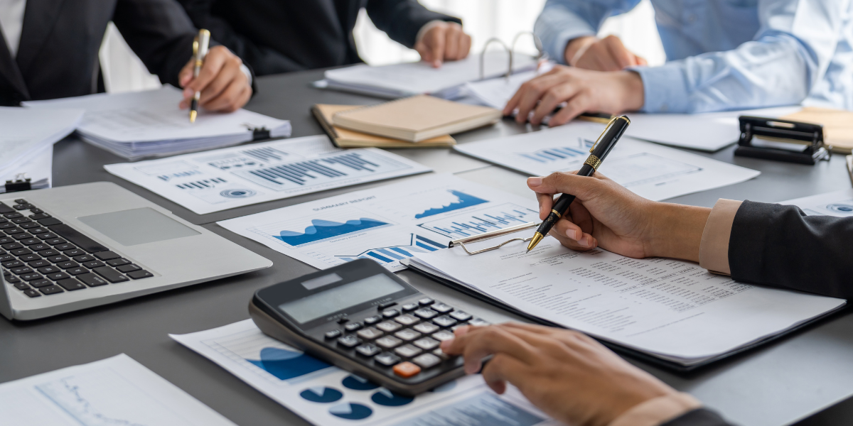 Pitman Accountants Skills Training A team of accountants working together, emphasizing that becoming an accountant without a degree is achievable through teamwork and on-the-job training.