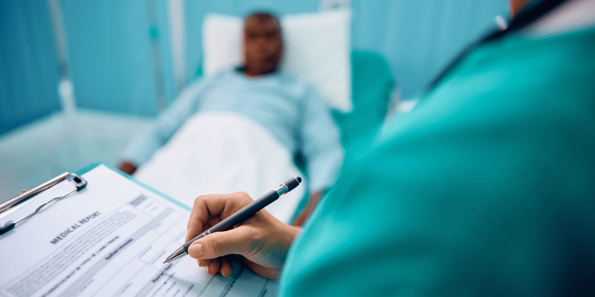 Pitman Healthcare professional reviewing patient information with elderly woman on tablet