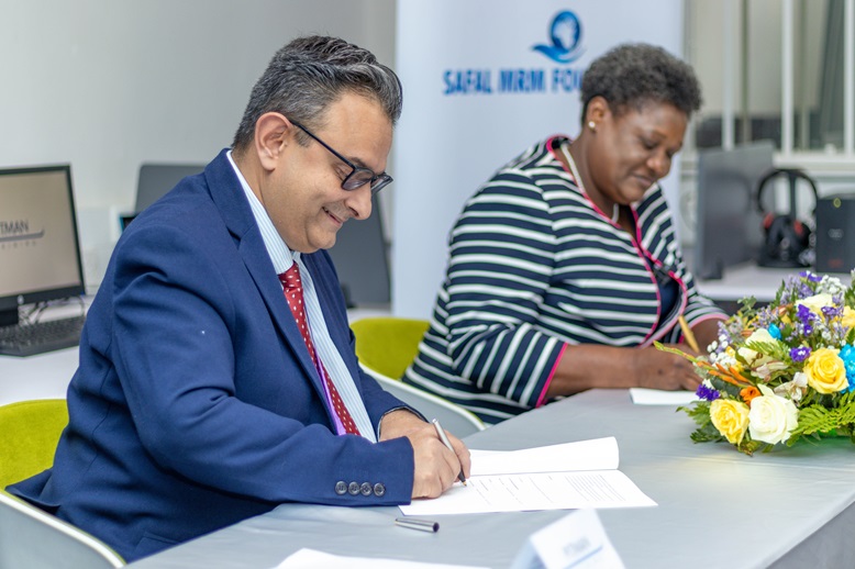 Safal MRM Foundation and Pitman Training Kenya leaders signing partnership agreement to empower Nairobi youth