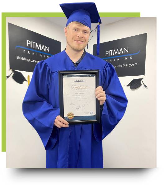 Data Analyst Diploma graduation at Pitman Training Sheffield Pitman Training Sheffield graduate James holding his Data Analyst Diploma at graduation