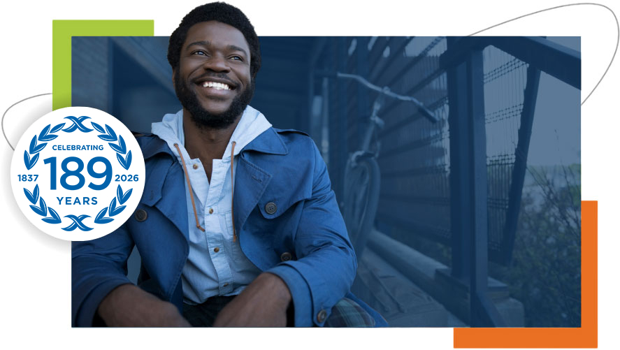 Professional development and workplace success Working professional smiling during a discussion in a modern office