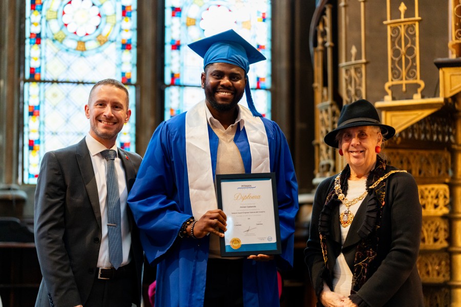 Ahmed Oyekanola receiving Student of the Year award at Pitman Training Newcastle Graduation 2025