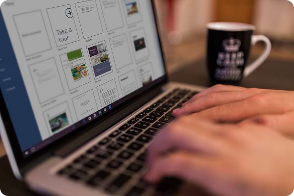 Apprentice developing business administration skills using office software